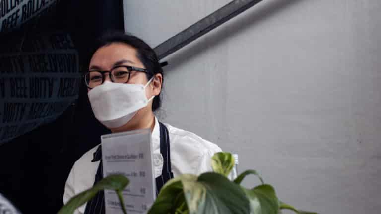 Chef Sepial Shim wearing a mask at Sepial's Kitchen